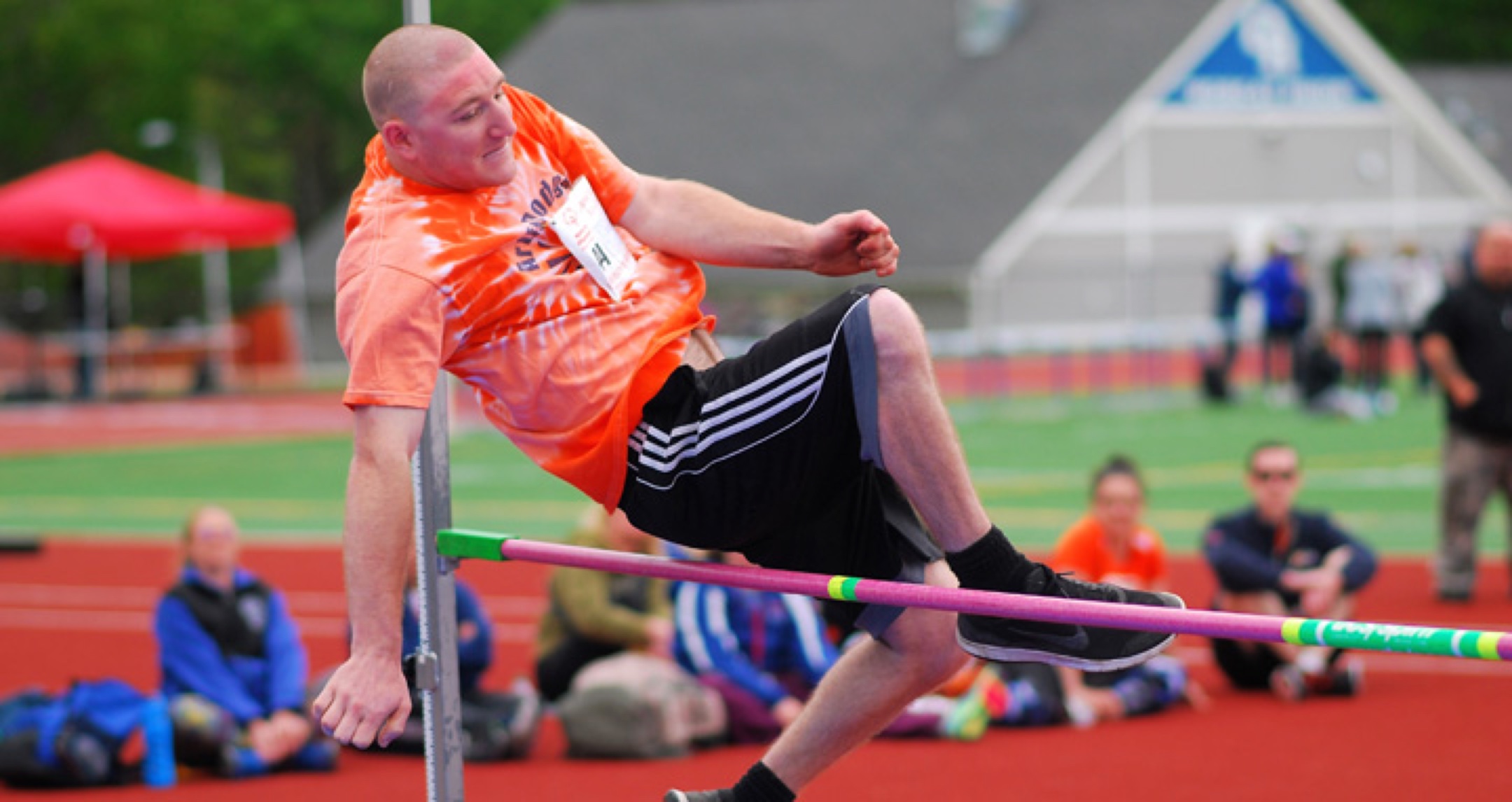 High jump athlete jumping over the bar